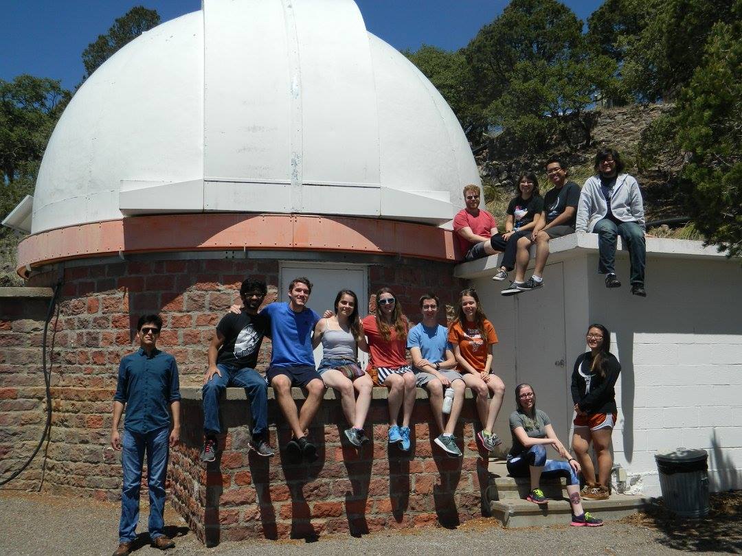 A photo of the UT Astronomy Students Association
																			 in front of the 36-inch telescope at McDonald Observatory